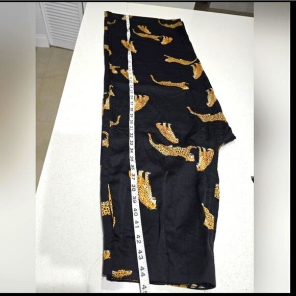Stylish black wide-leg pants. Features a bold leopard print. - Picture 13 of 15